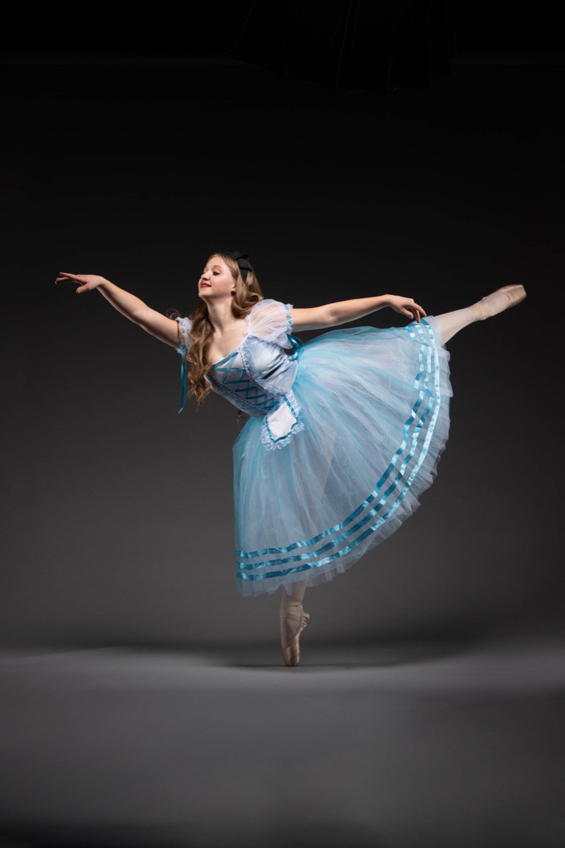 Classical ballet dancer in elegant pose during performance